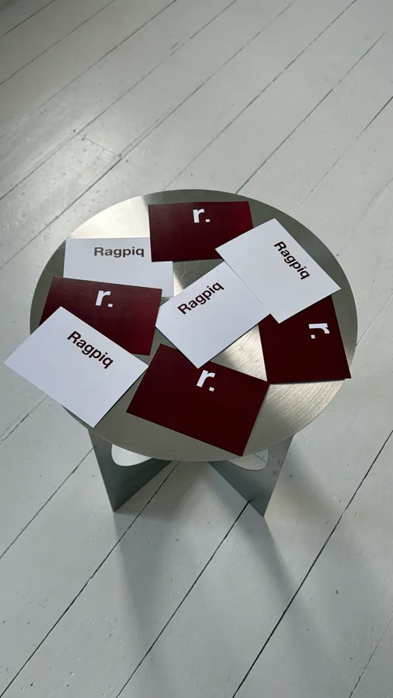 Ragpiq cards laid out on a stone surface after a sale
